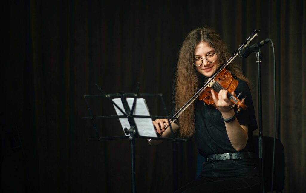 Classical musician playing the violin on stage