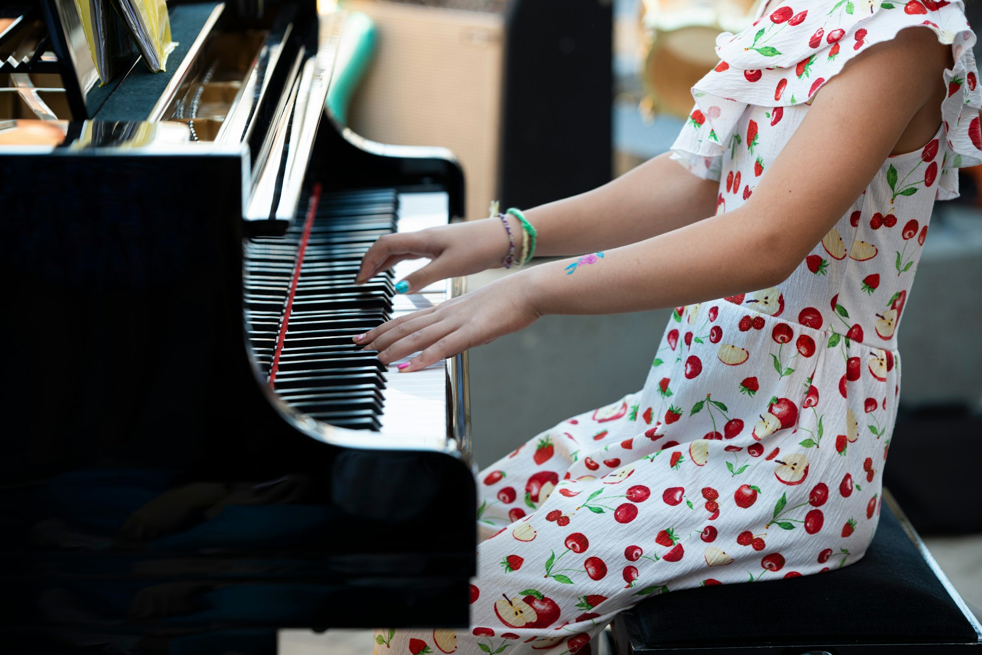Girl playing a gran piano
