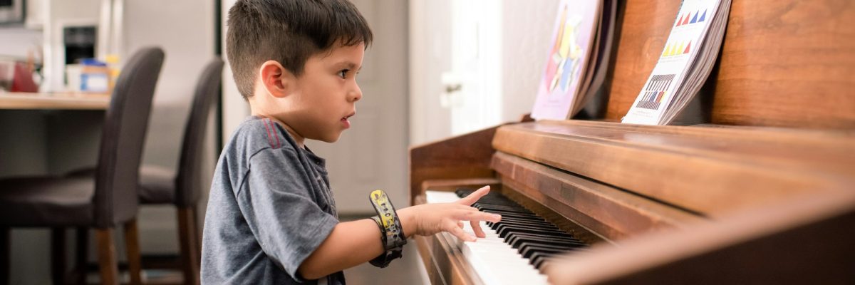 Boy practicing piano