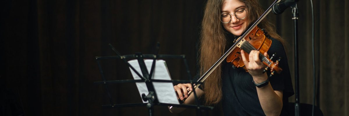 Classical musician playing the violin on stage